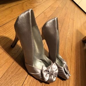 Silver satin heels.